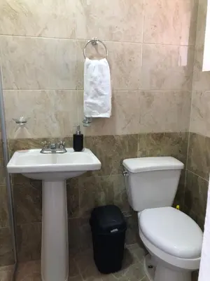 Un baño de Departamento Zeus 12